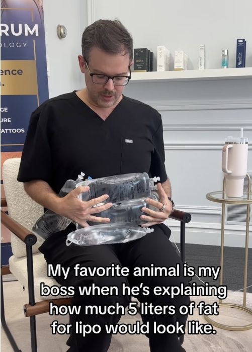 Doctor demonstrating fat volume for liposuction.