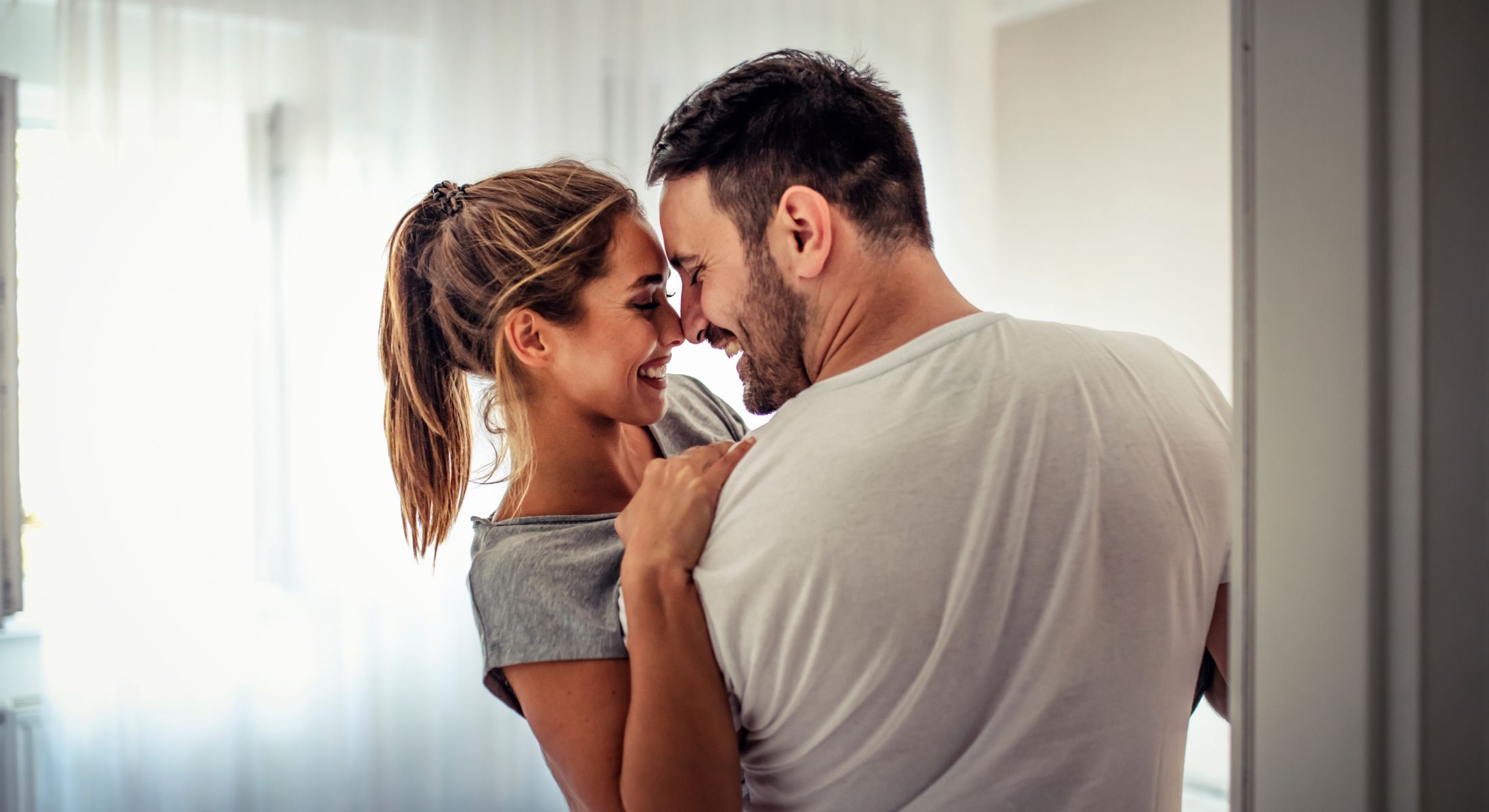 Hinsdale sexual health models sharing a joyful moment indoors together.