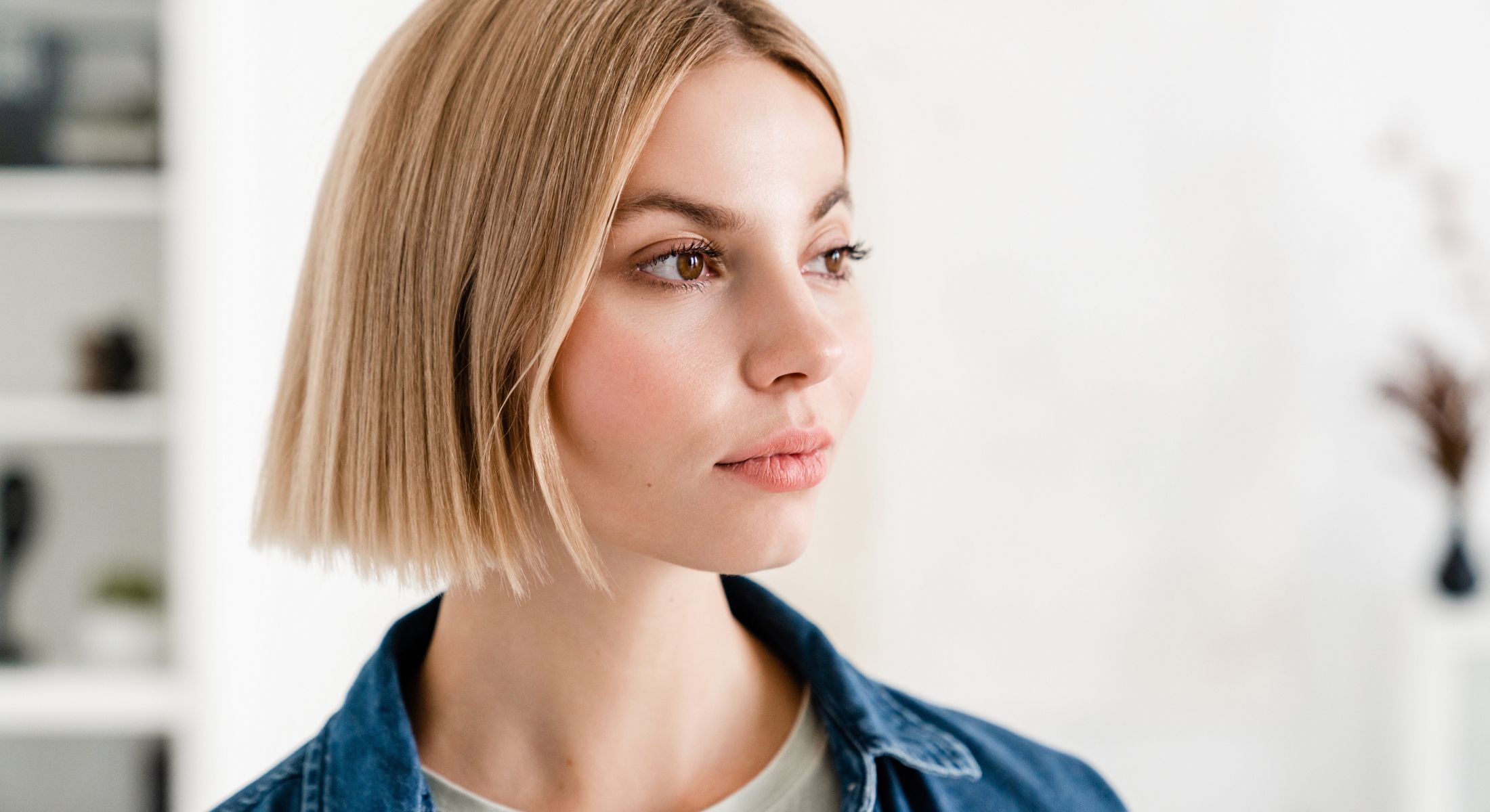 Hinsdale microneedling model with short blonde hair in denim jacket.
